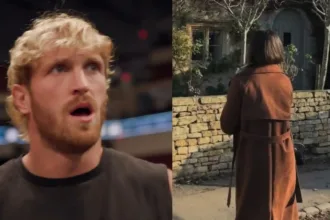 Logan Paul holding WWE championship belts inside the ring.