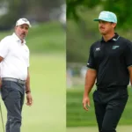 Phil Mickelson Advising Mito Pereira On A Golf Course At Sunset