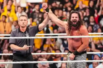 Seth Rollins In Wwe Ring Wearing A Shoulder Brace Looking Determined