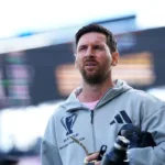 Inter Miami Players Celebrating With Lionel Messi In Front Of Cheering Supporters After A Goal In An Mls Match.