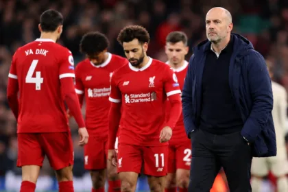 Liverpool players and head coach Arne Slot on the pitch during a Premier League match