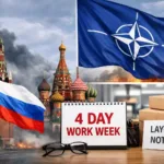 Russian industrial plant exterior with smoke stacks and workers at entrance